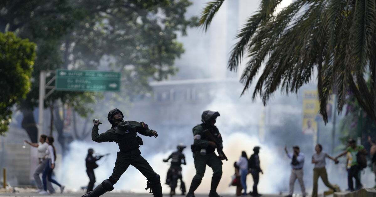 Police hurl a tear gas canister at protesters demonstrating against the announced election results declaring Nicolas Maduro's reelection, the day after the vote, in Caracas, Venezuela, July 29, 2024.
