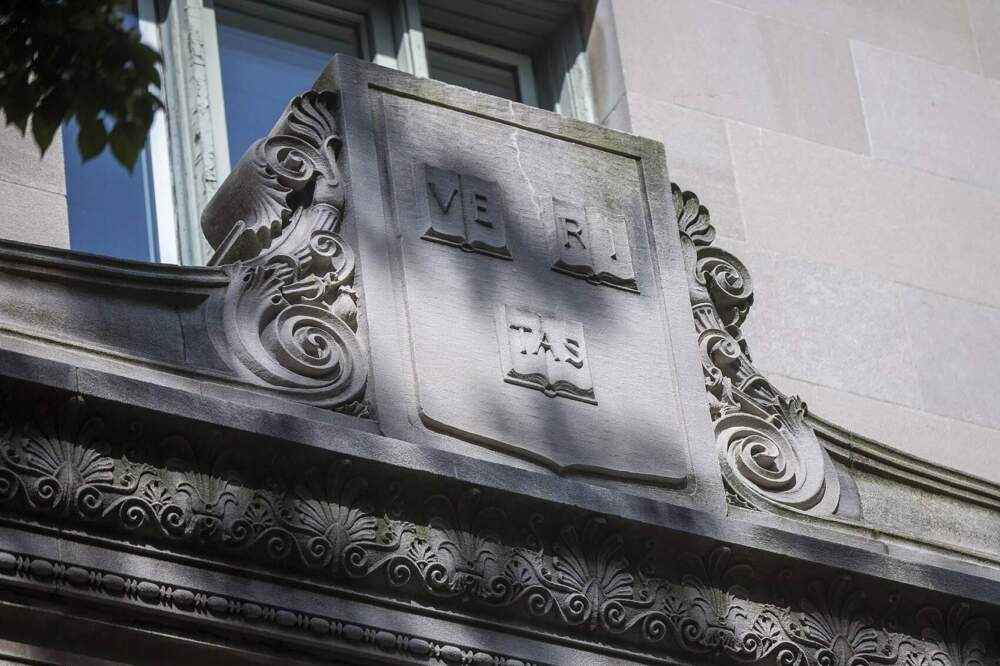 The Harvard crest on the facade of Langdell Hall at the Harvard Law School. (Jesse Costa/WBUR)