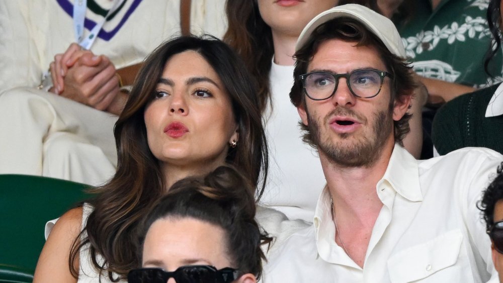 LONDON, ENGLAND - JULY 06: (L-R) Monica Barbaro, Andrew Garfield and Matthew Broome, wearing Ralph Lauren, attend day seven of the Wimbledon Tennis Championships at the All England Tennis and Croquet Club on July 06, 2025 in London, England. (Photo by Karwai Tang/Getty Images for Ralph Lauren)