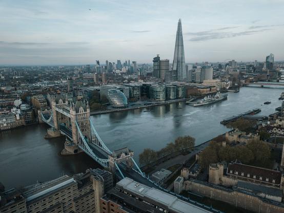 A view over the City of London taken over the Thames near Tower Bridge. (Cj/Unsplash+)