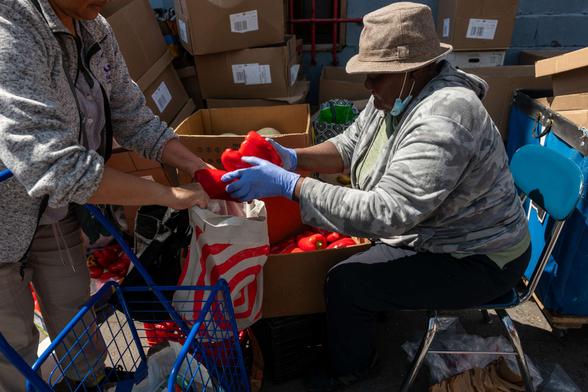 Residents participate in a twice-weekly food distribution at a church in the South Bronx on April 23, 2025, in New York City.