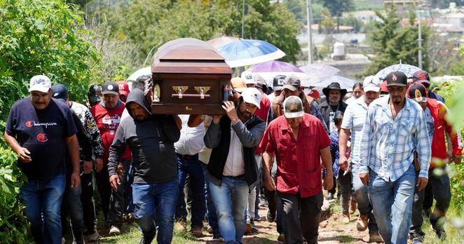 Zinapecuaro, Michoacan - July 26: Residents of the Huajumaro de Guadalupe community bid their final farewell to Jaime Alanis Garcia, a Mexican man killed in a raid by Immigration and Customs Enforcement (ICE) agents in Camarillo, California, on Saturday, July 26, 2025 in Huajumaro de Guadalupe, outside of Zinapecuaro, Michoacan, Mexico. On July 10, federal immigration agents raided two cannabis greenhouse operations owned by Glass House Farms, setting off an intense, hours-long standoff between federal agents and protesters outside the company's Camarillo site. Alanis Garcia was fatally injured when he climbed atop a greenhouse and fell 30 feet while fleeing immigration agents at Glass House, his family said. (Juan Jose Estrada Serafin / For The Times)