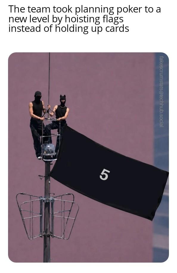 Photo of a couple who scaled the Empire State Building and unfurled a flag.

The flag is edited to display the number 5

Caption: The team took planning poker to a new level by hoisting flags instead of holding up cards